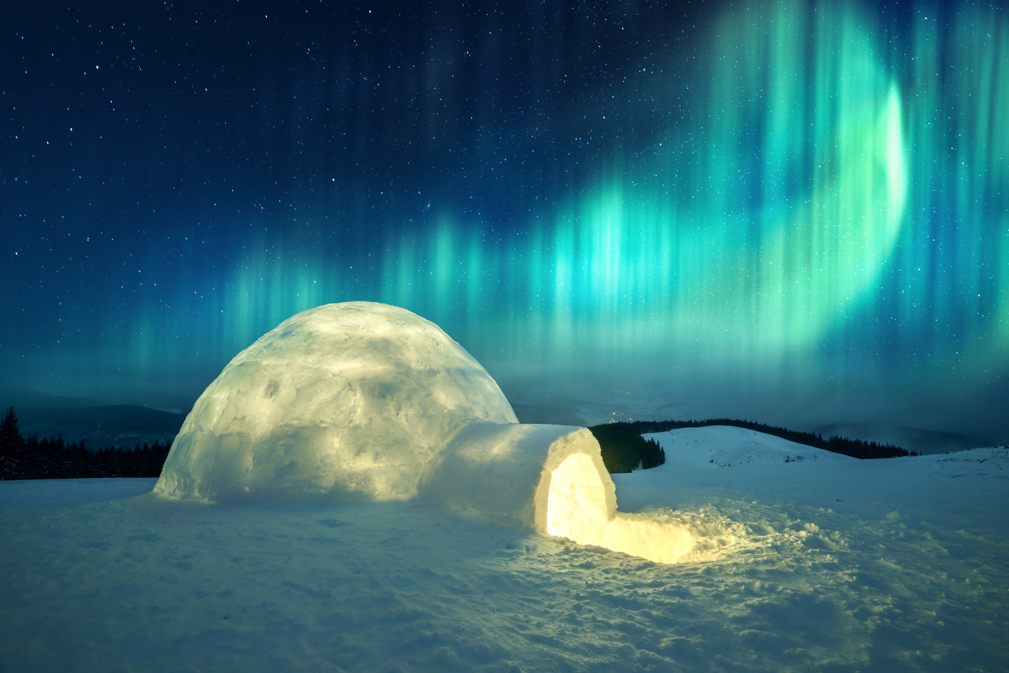 Wintry scene with glowing polar lights and snowy igloo