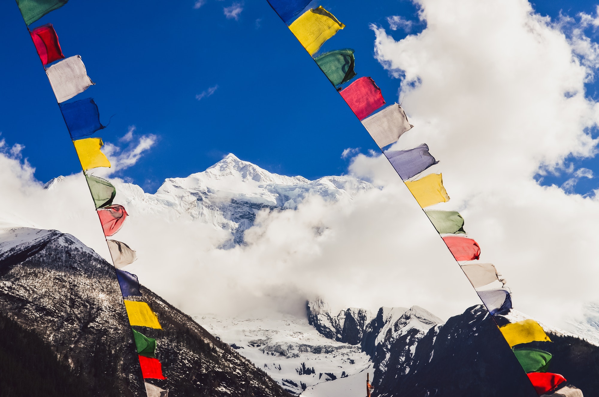 Himalayas mountain peak and Nepal colorful flags, Nepal